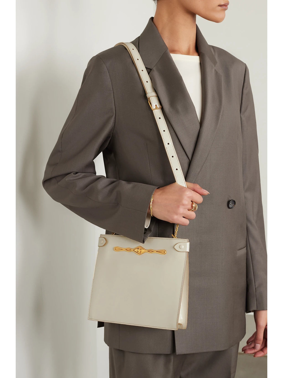 Image of Bags. Product name - + Fernando Jorge Stowaway Embellished Glossed-leather Shoulder Bag in White colour by brand - Métier