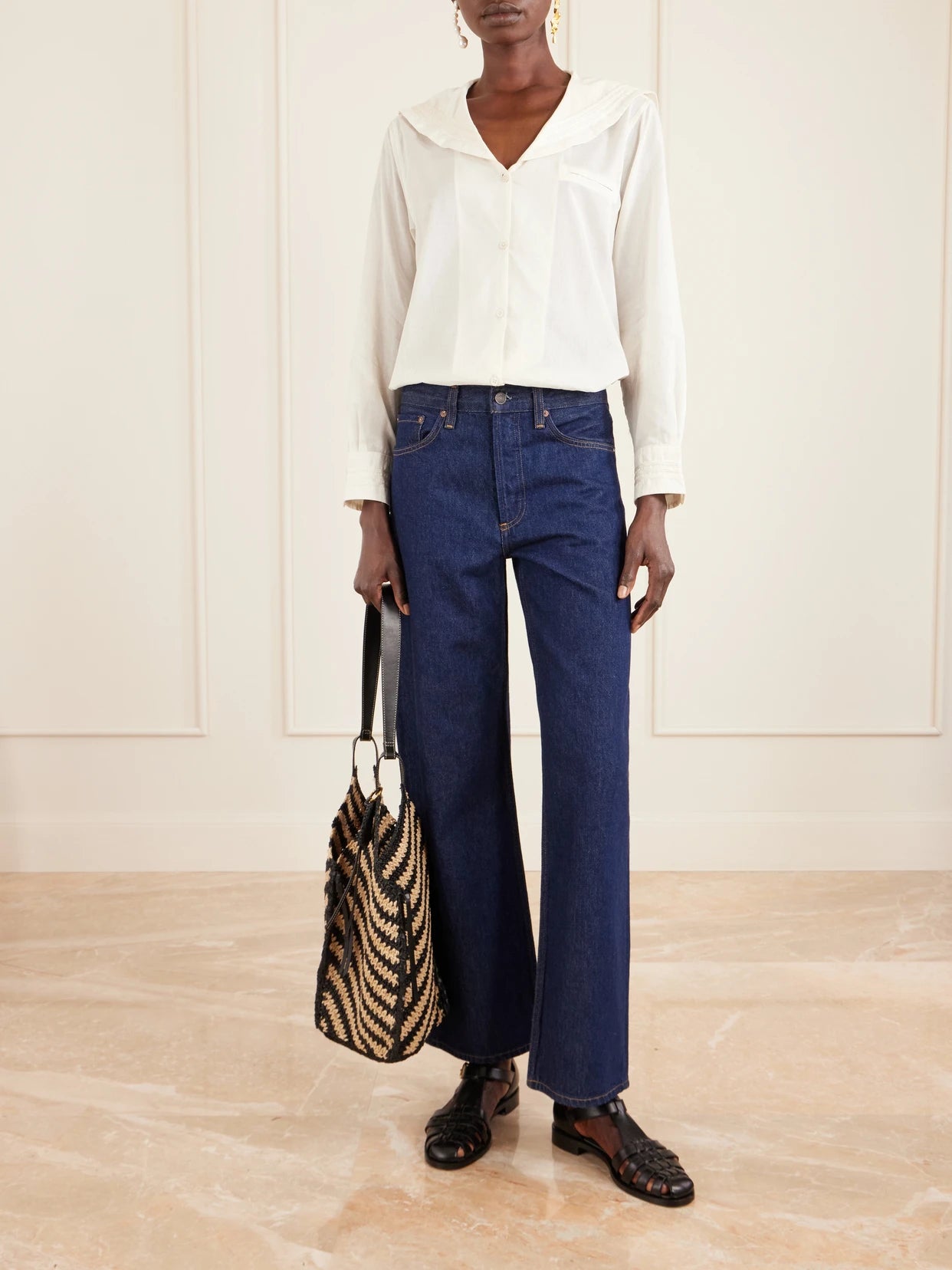 Image of a model wearing Tops. Product name - Marina Cotton-voile Shirt in Ivory colour by brand - BODE