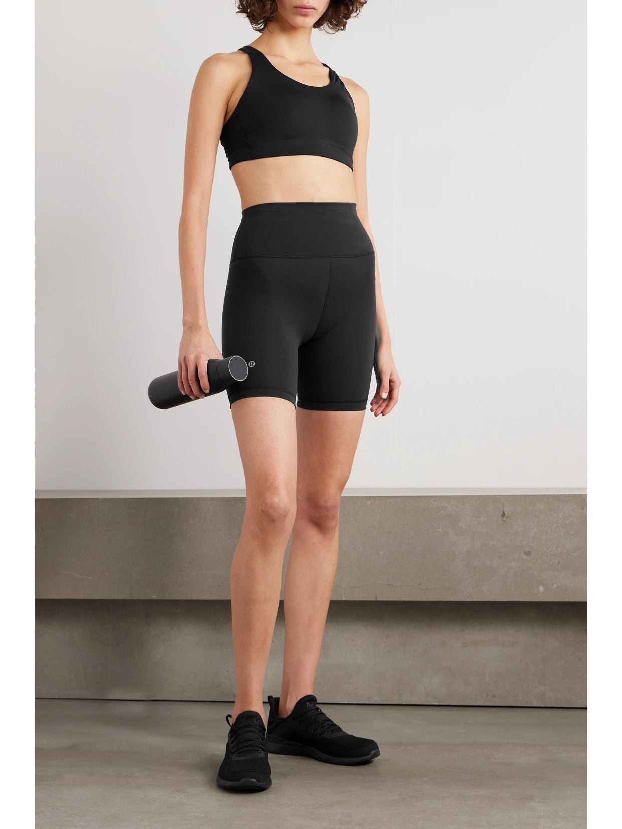 Image of a model wearing Shorts. Product name - Wunder Train Everlux High-rise Shorts - 6" in Black colour by brand - lululemon