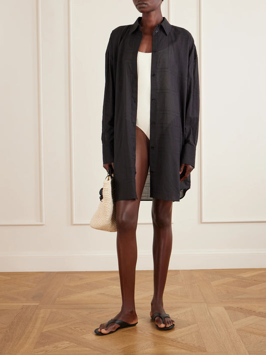 Image of a model wearing Tops. Product name - Organic Cotton And Lyocell-blend Shirt in Black colour by brand - TOTEME