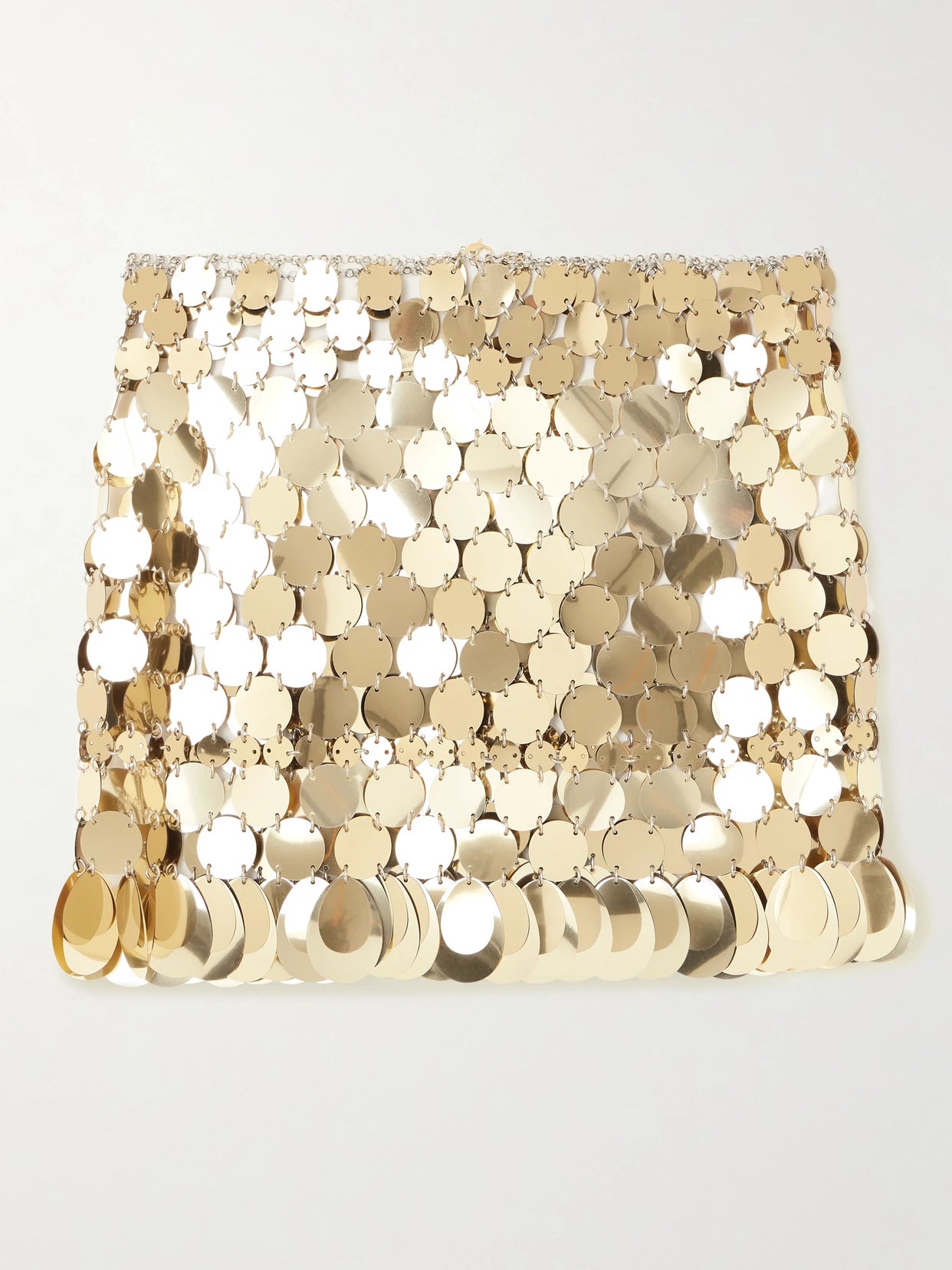 Image of a model wearing Skirts. Product name - Paillette-embellished Chainmail Mini Skirt in Gold colour by brand - RABANNE