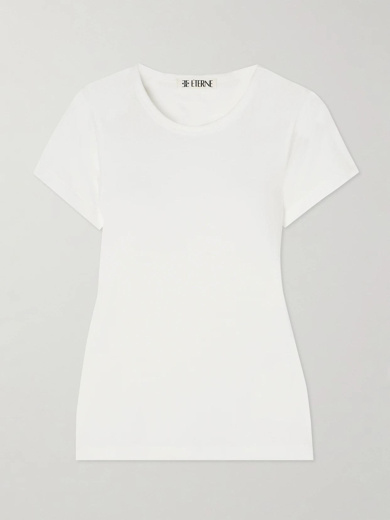 Image of a model wearing Tops. Product name - Short Sleeve Baby Tee Cotton And Modal-blend Jersey T-shirt in Ivory colour by brand - ÉTERNE