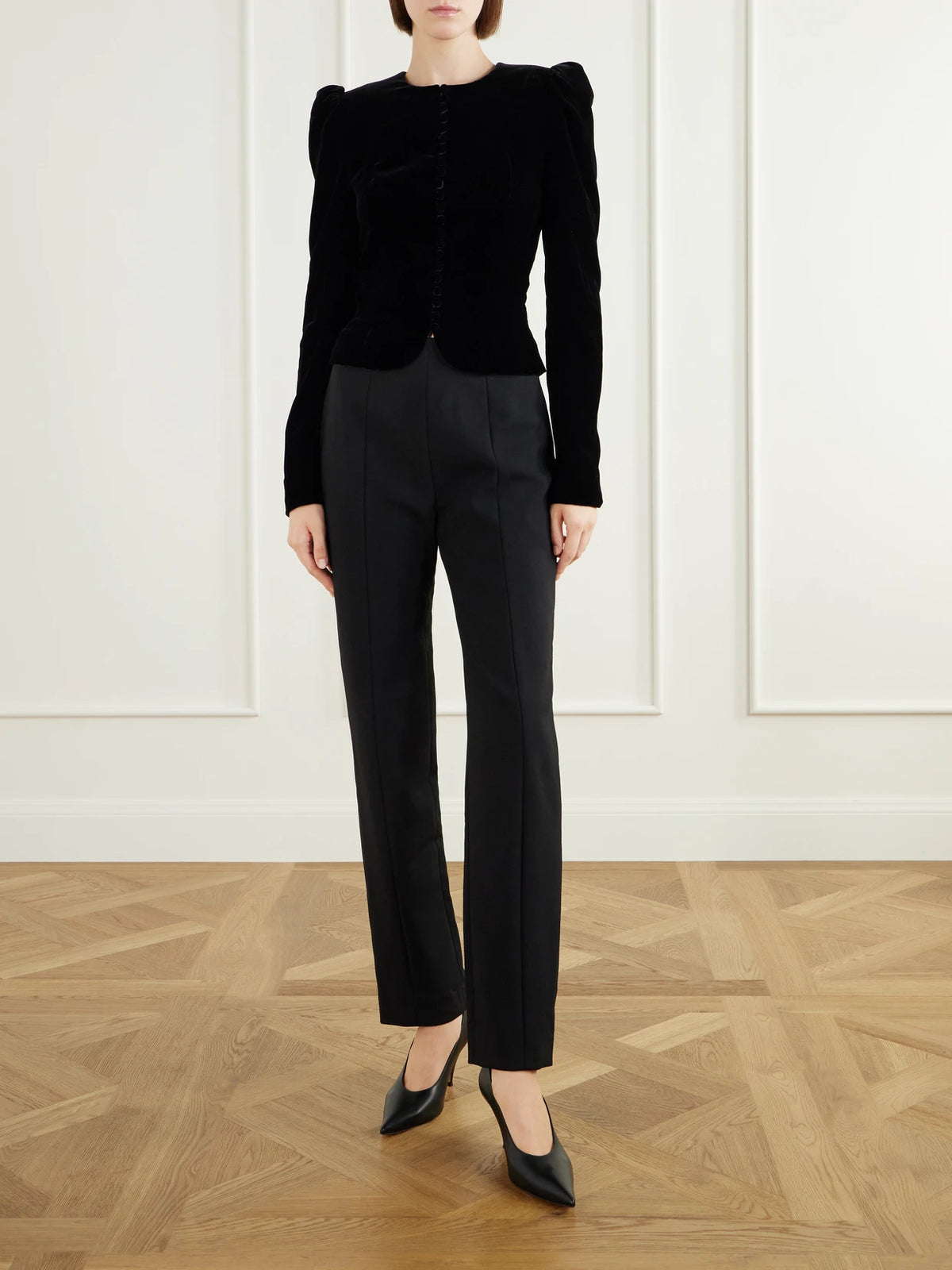 Image of a model wearing Pants. Product name - High-waist Slim-leg Stretch-wool Pants in Black colour by brand - Carolina Herrera