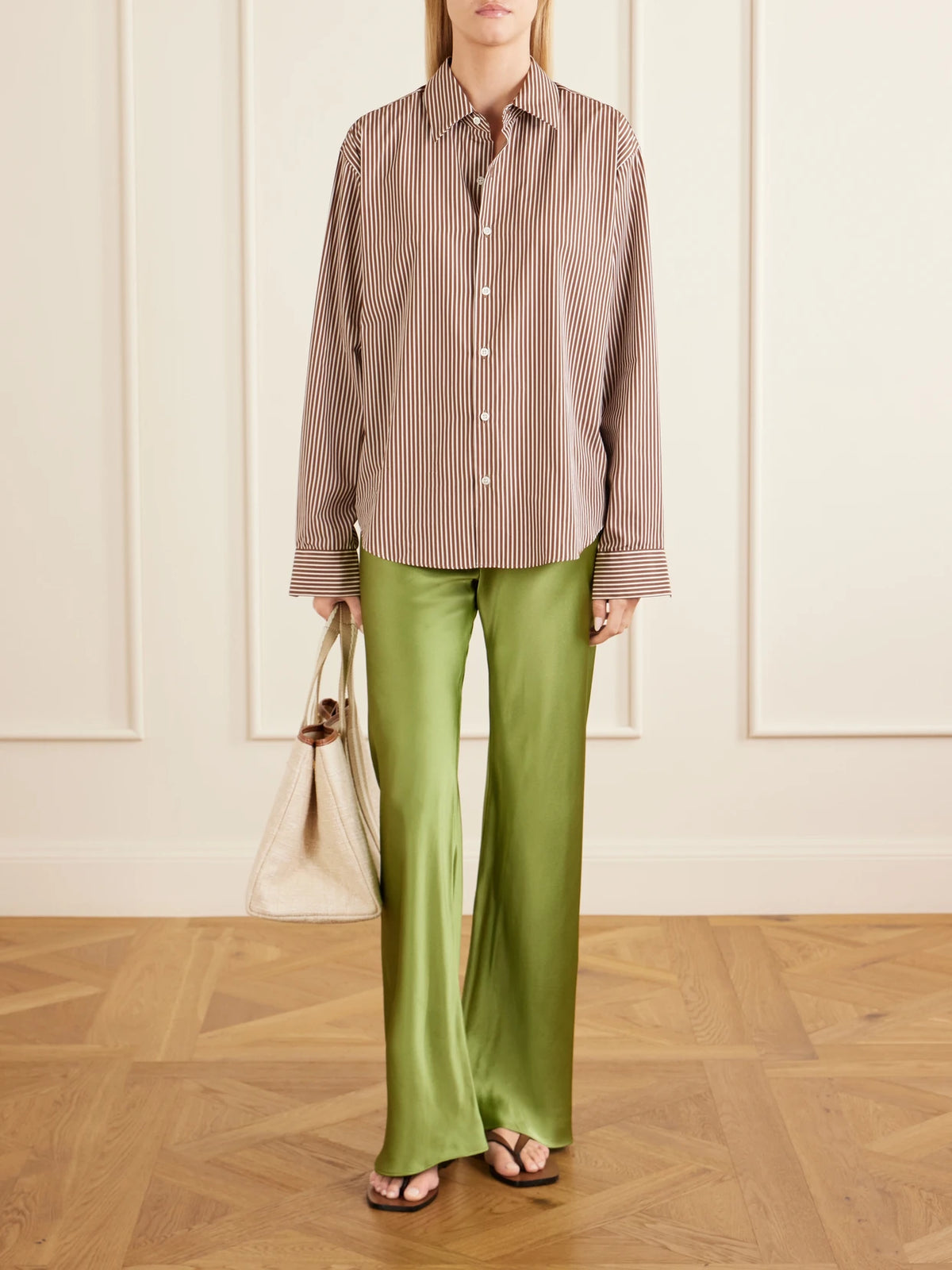 Image of a model wearing Pants. Product name - Silk-bias Straight-leg Pants in Green colour by brand - Comme Si