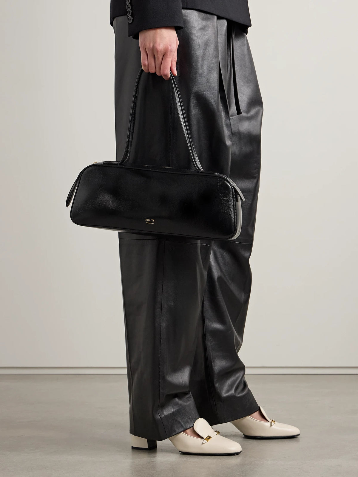 Image of Bags. Product name - Simona Glossed-leather Shoulder Bag in Black colour by brand - KHAITE