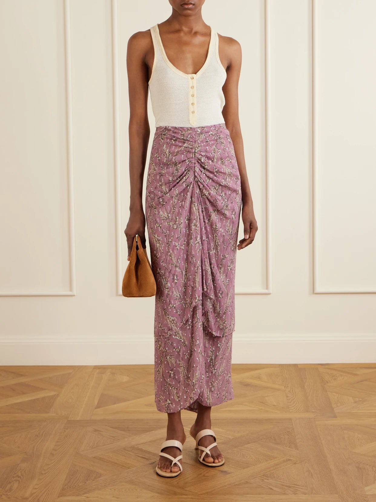 Image of a model wearing Skirts. Product name - Sira Ruffled Floral-print Metallic Maxi Skirt in Pink colour by brand - Veronica Beard
