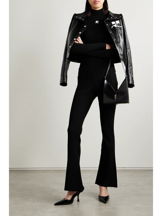 Image of a model wearing Outerwear. Product name - Reedition Embroidered Ribbed-knit Turtleneck Sweater in Black colour by brand - COURREGES
