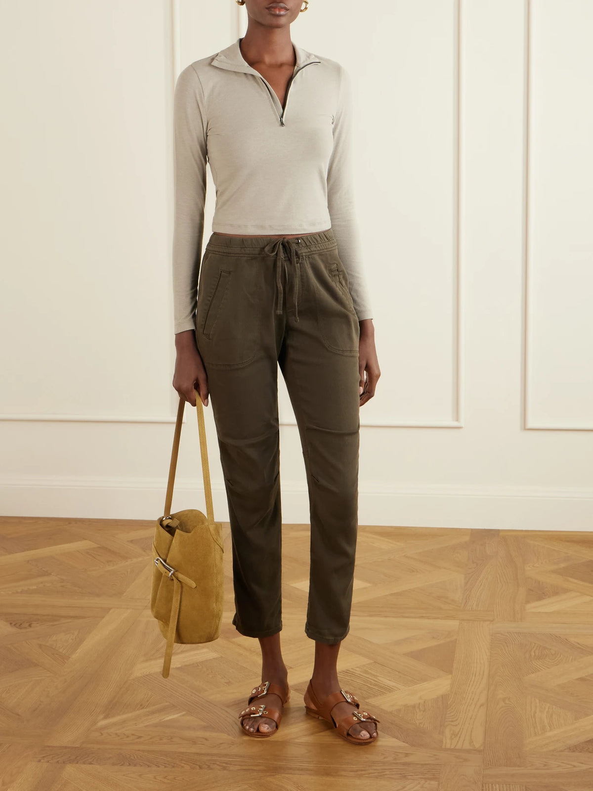 Image of a model wearing Tops. Product name - Cropped Cotton-blend Half-zip Top in Beige colour by brand - James Perse