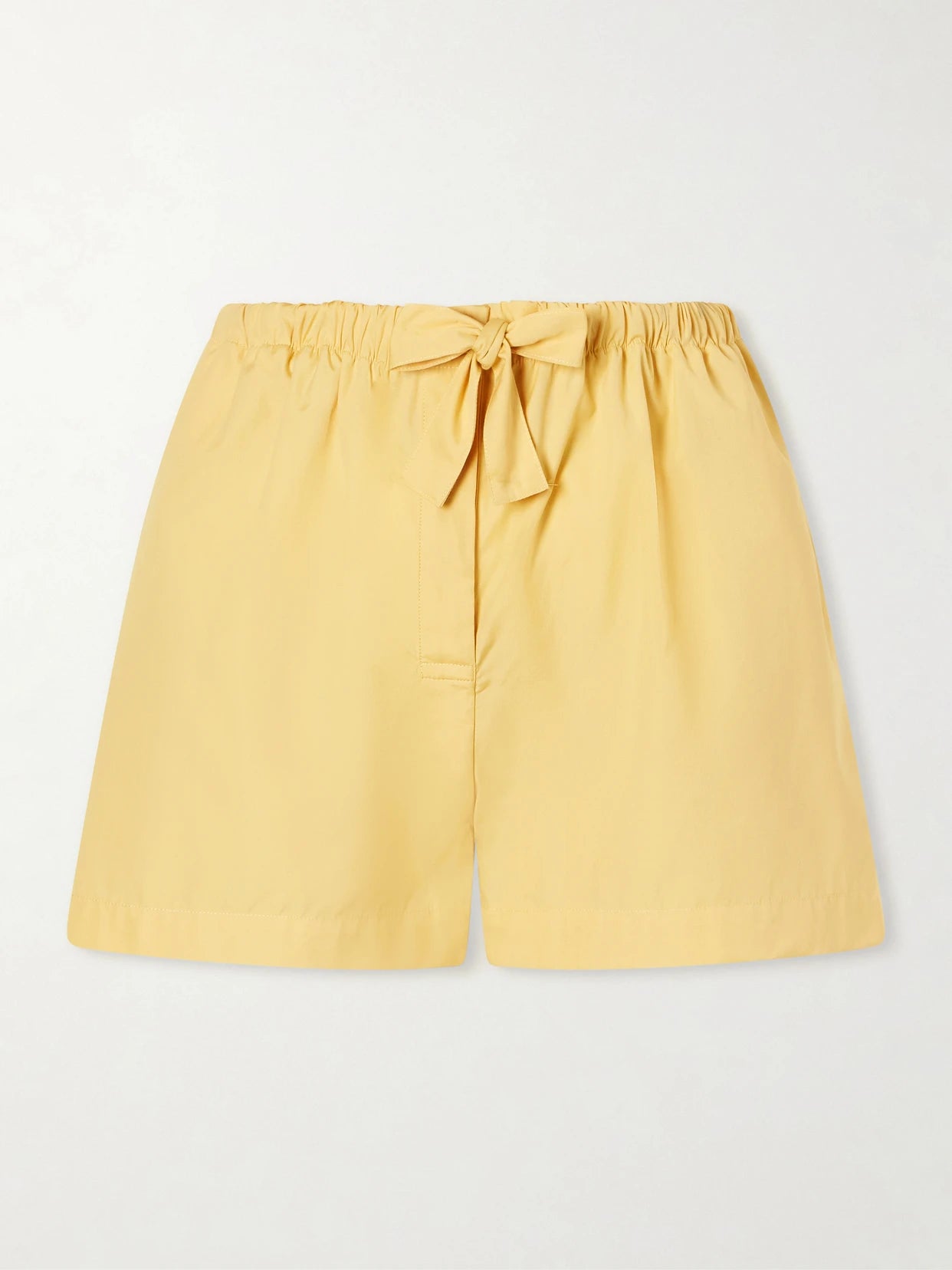 Image of a model wearing Shorts. Product name - Cotton-poplin Shorts in Yellow colour by brand - TOTEME