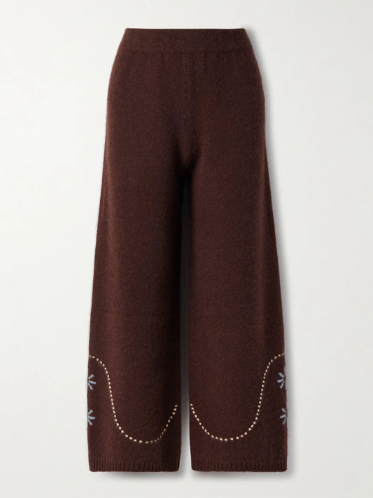 Image of a model wearing Outerwear. Product name - Intarsia-knit Cashmere Wide-leg Pants in Chocolate colour by brand - Calle Del Mar
