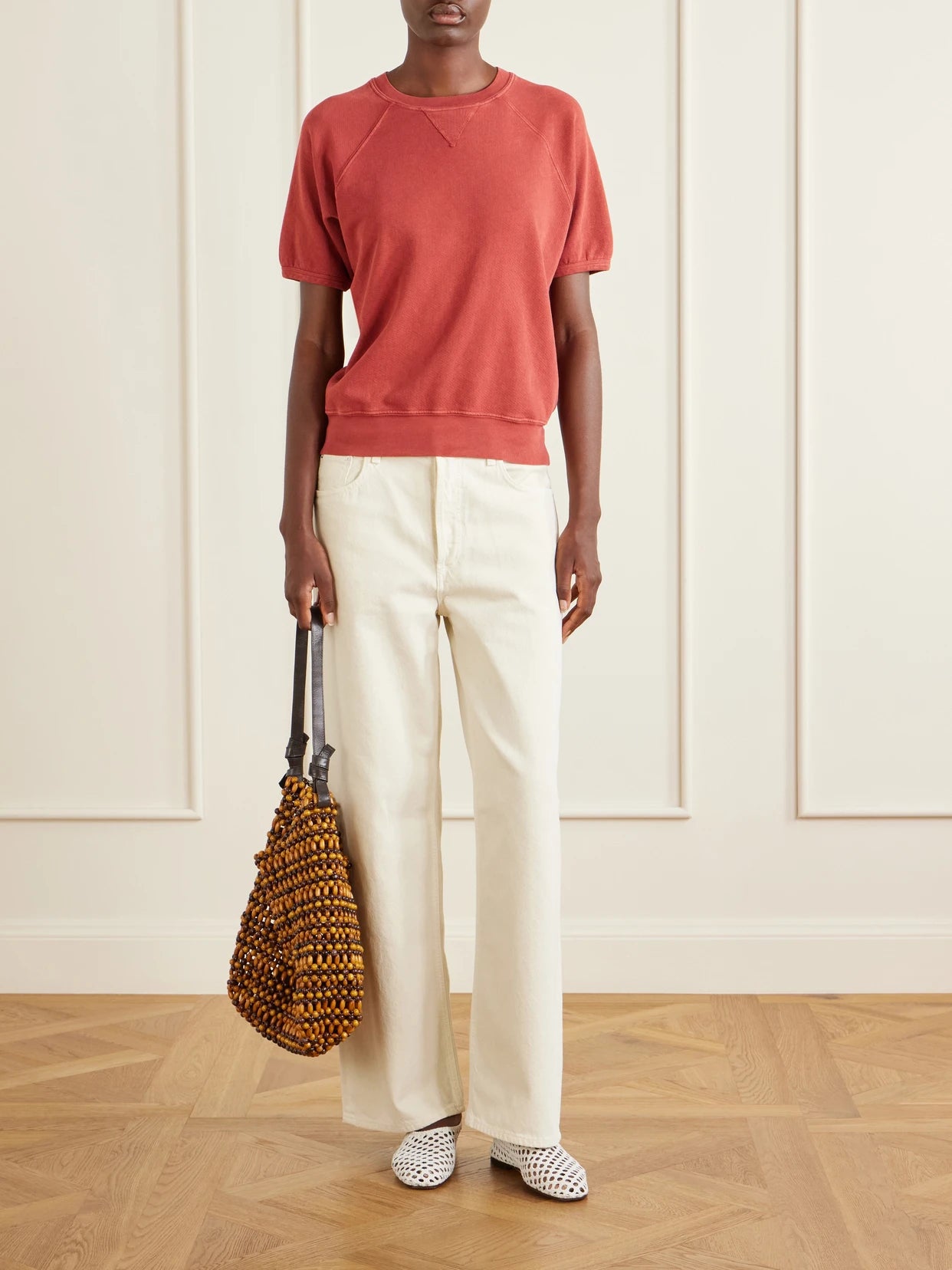 Image of a model wearing Tops. Product name - Cotton Jersey T-shirt in Crimson colour by brand - B SIDES