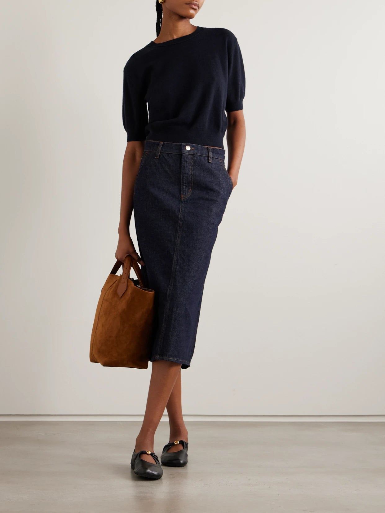Image of a model wearing Outerwear. Product name - Genevra Cashmere T-shirt in Navy colour by brand - LISA YANG