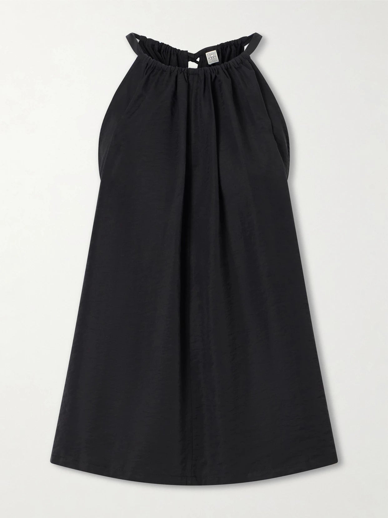 Image of a model wearing Tops. Product name - Gathered Lyocell-blend Halterneck Top in Black colour by brand - TOTEME