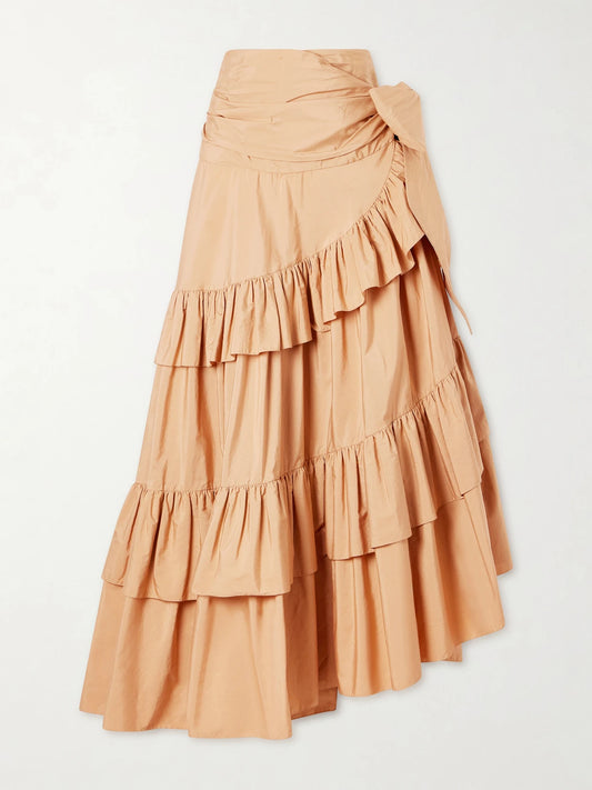 Image of a model wearing Skirts. Product name - Bow-detailed Ruffled Organic Cotton-poplin Midi Skirt in Beige colour by brand - Chloé