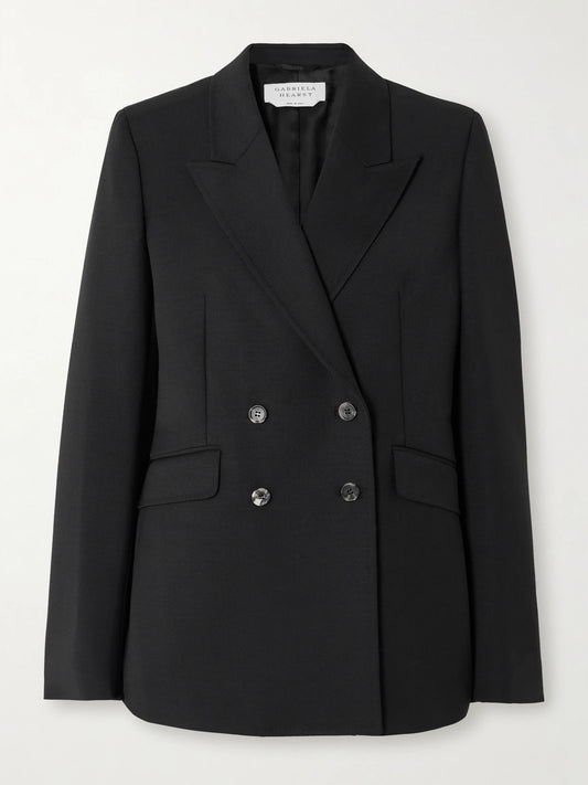 Image of a model wearing Outerwear. Product name - Angela Double-breasted Wool-crepe Blazer in Black colour by brand - Gabriela Hearst