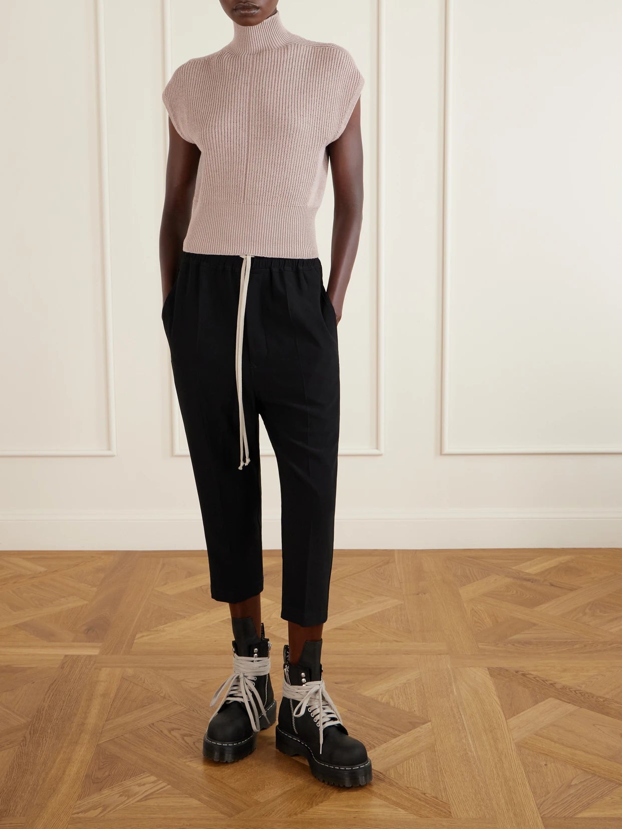 Image of a model wearing Outerwear. Product name - Ribbed Wool Turtleneck Top in Blush colour by brand - Rick Owens