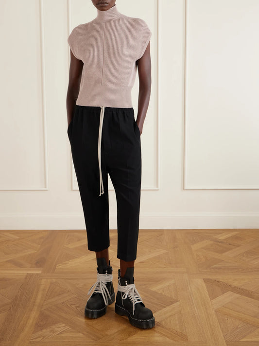 Image of a model wearing Outerwear. Product name - Ribbed Wool Turtleneck Top in Blush colour by brand - Rick Owens