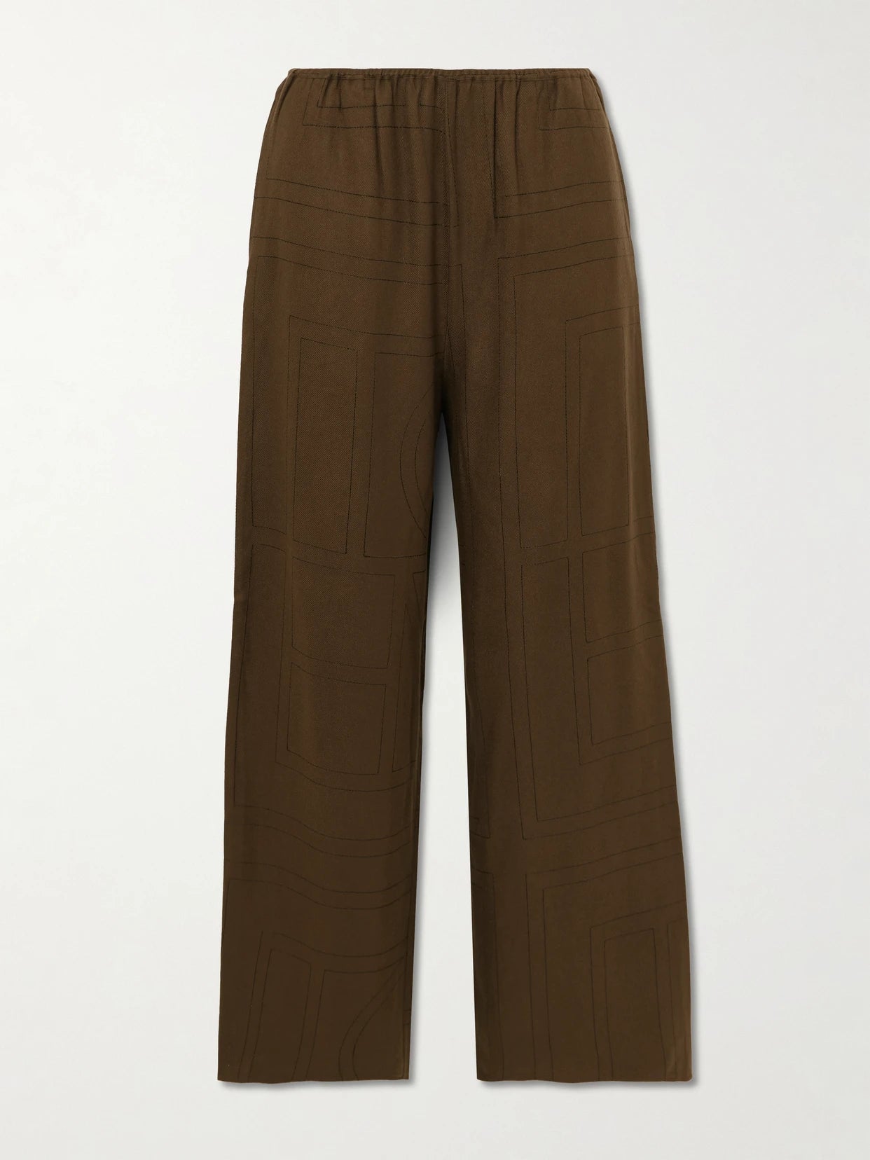 Image of a model wearing Pants. Product name - Embroidered Tencel Lenzing Modal Pants in Dark brown colour by brand - TOTEME