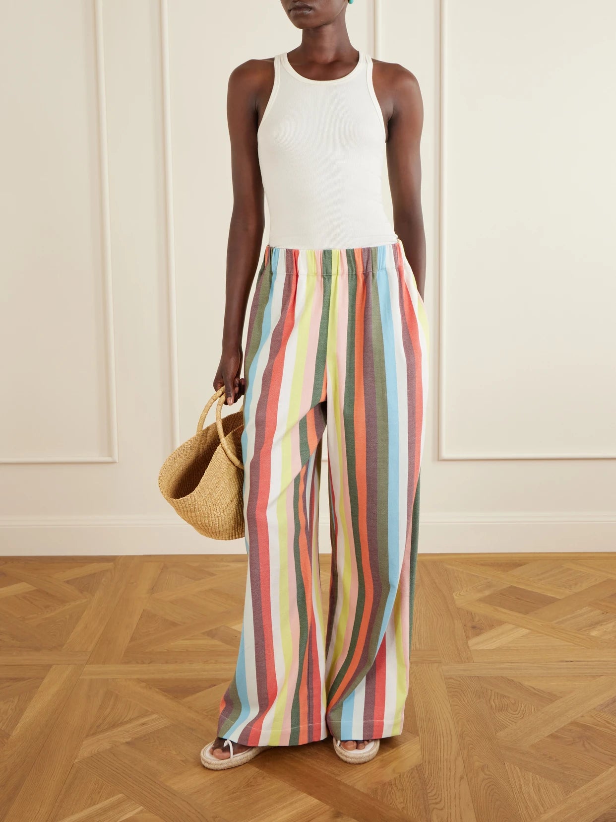 Image of a model wearing Pants. Product name - The Palazzo Striped Cotton Wide-leg Pants in Multi colour by brand - Marrakshi Life