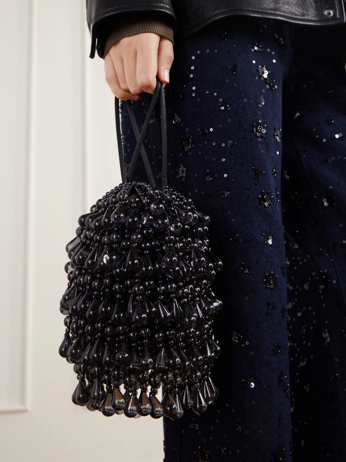 Image of Bags. Product name - Zia Wristlet Beads-detailed Satin To-handle Bag in Black colour by brand - Cult Gaia