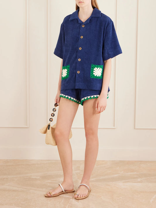 Image of a model wearing Tops. Product name - Boxy Crochet-knit Trimmed Organic Cotton-terry Shirt in Blue, White, Beige colour by brand - Terry Puesto
