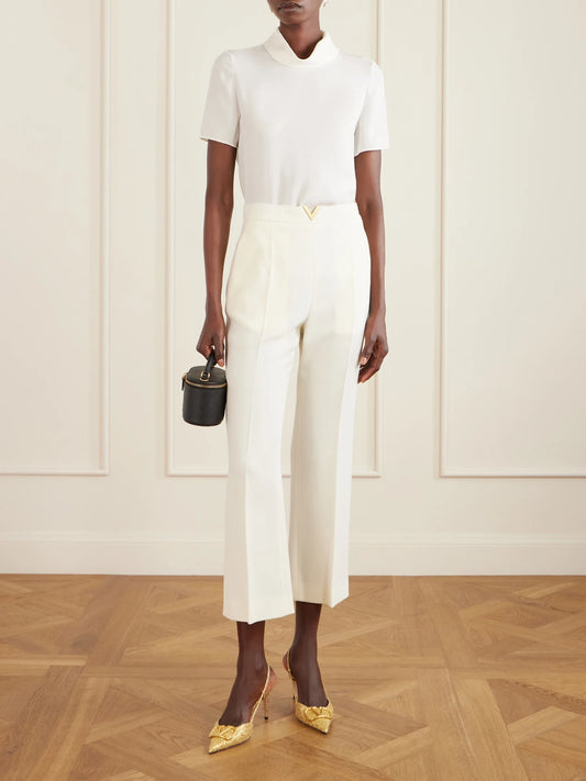 Image of a model wearing Tops. Product name - Silk-georgette Blouse in Cream colour by brand - Valentino Garavani
