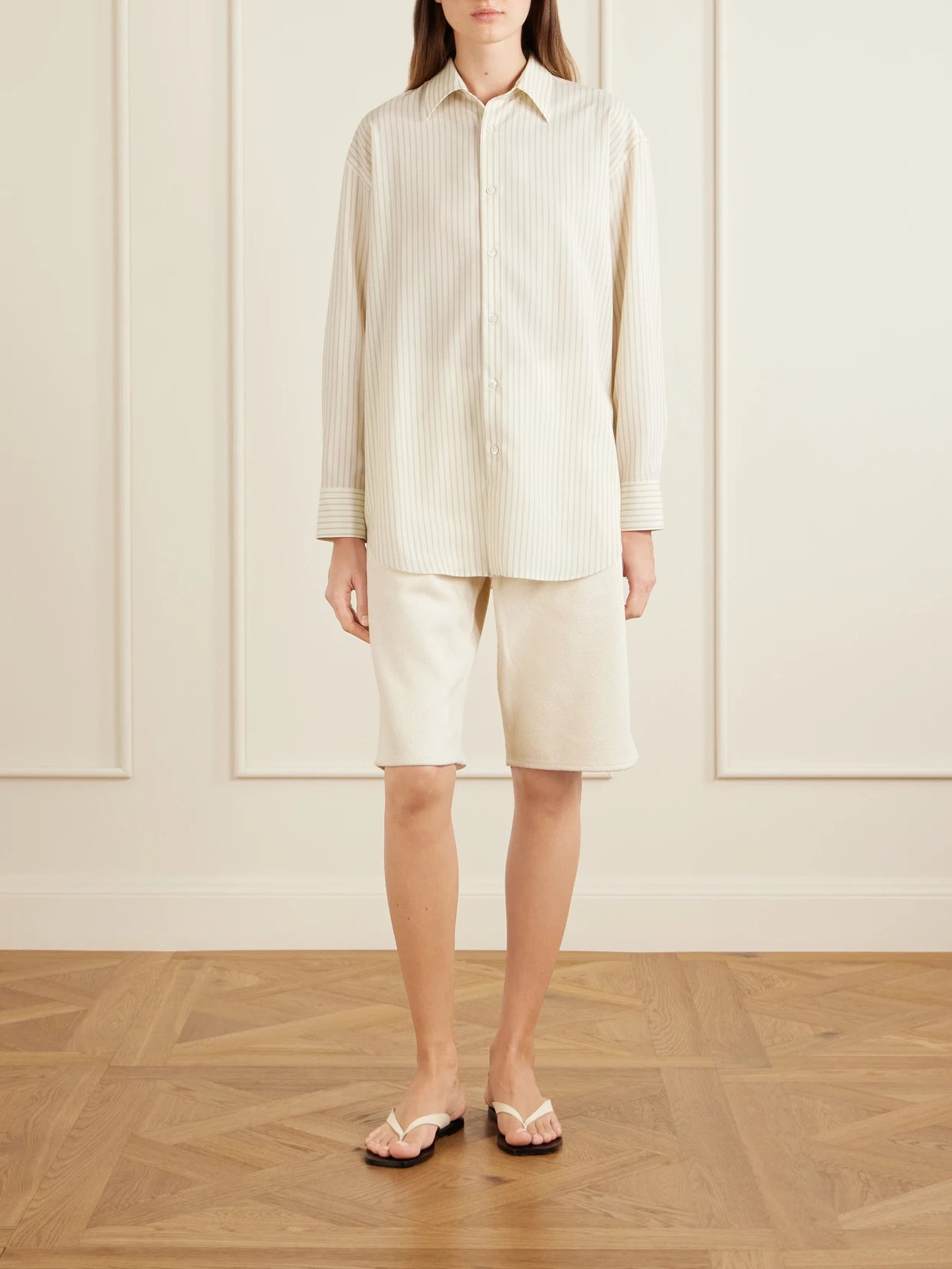 Image of a model wearing Tops. Product name - Striped Wool Shirt in Pastel yellow colour by brand - Auralee
