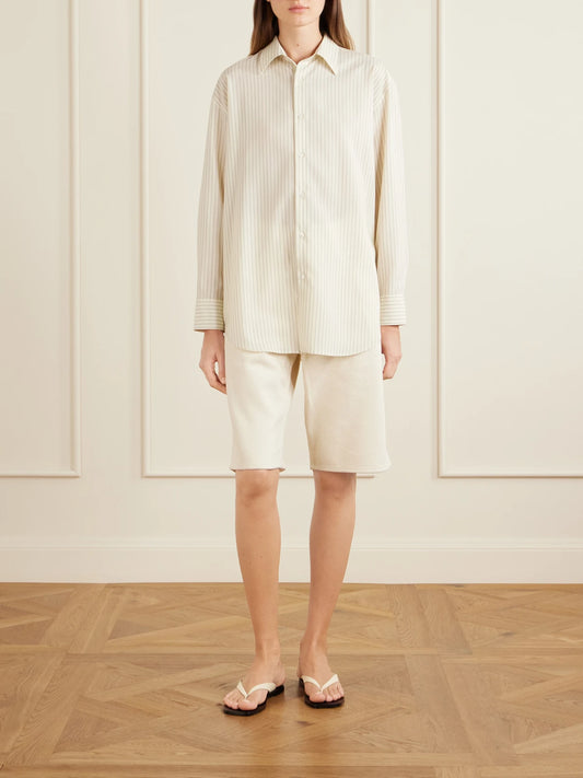 Image of a model wearing Tops. Product name - Striped Wool Shirt in Pastel yellow colour by brand - Auralee