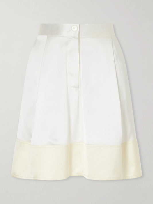 Image of a model wearing Skirts. Product name - Satin Mini Skirt in White colour by brand - TOTEME
