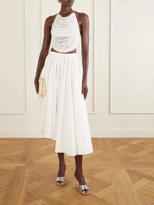 Image of a model wearing Tops. Product name - Tanner Bead-embellished Silk-blend Satin Tank in Off-white colour by brand - Cult Gaia