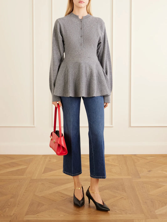 Image of a model wearing Outerwear. Product name - Wool Peplum Sweater in Gray colour by brand - Stella McCartney