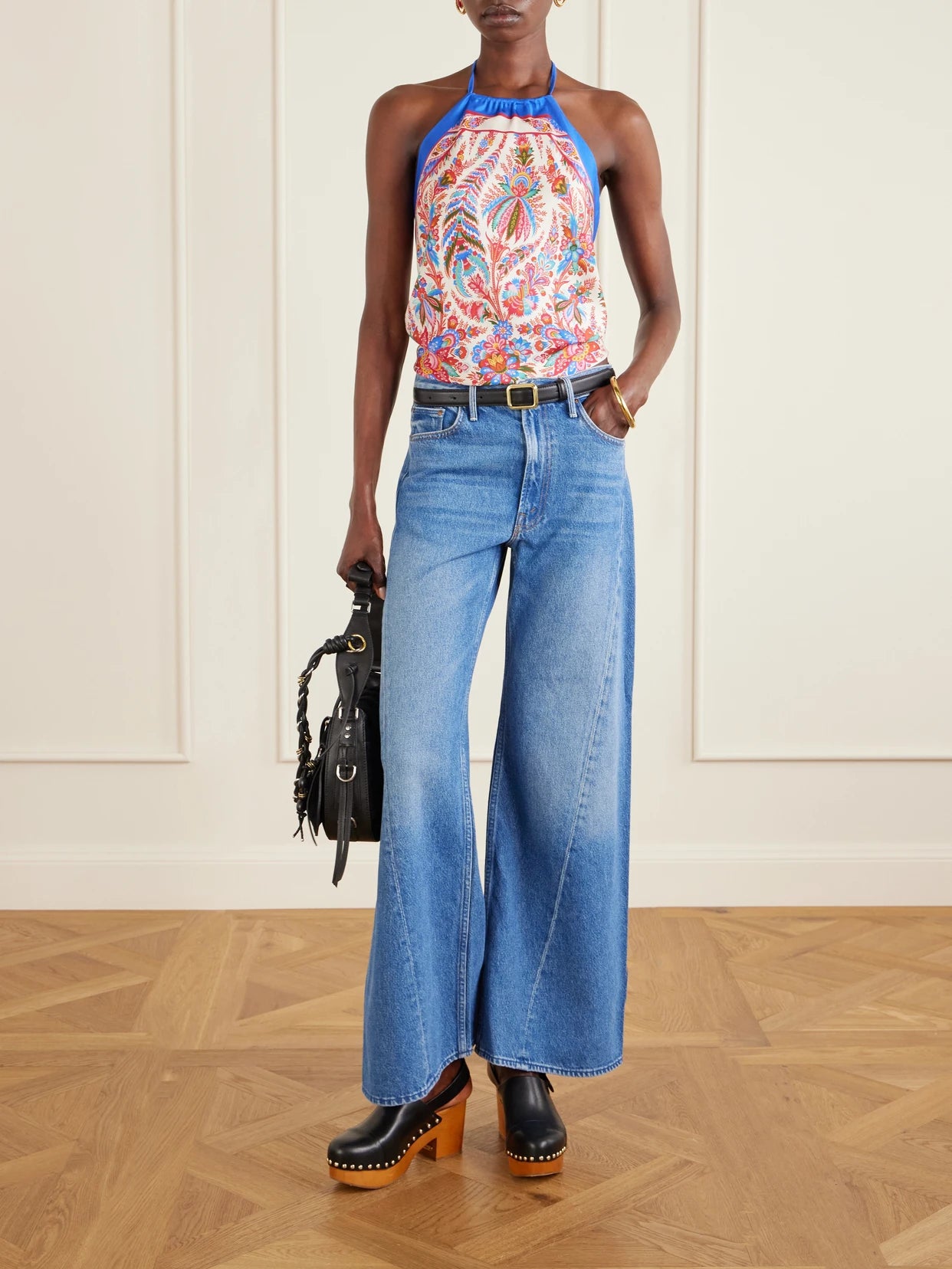 Image of a model wearing Tops. Product name - Cropped Printed Silk-satin Halterneck Top in Multi colour by brand - Etro