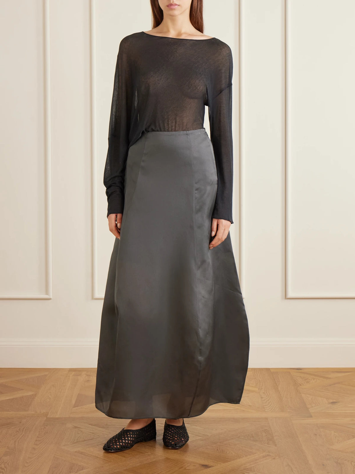 Image of a model wearing Skirts. Product name - Cocoon Silk-organza Maxi Skirt in Dark gray colour by brand - Ruohan