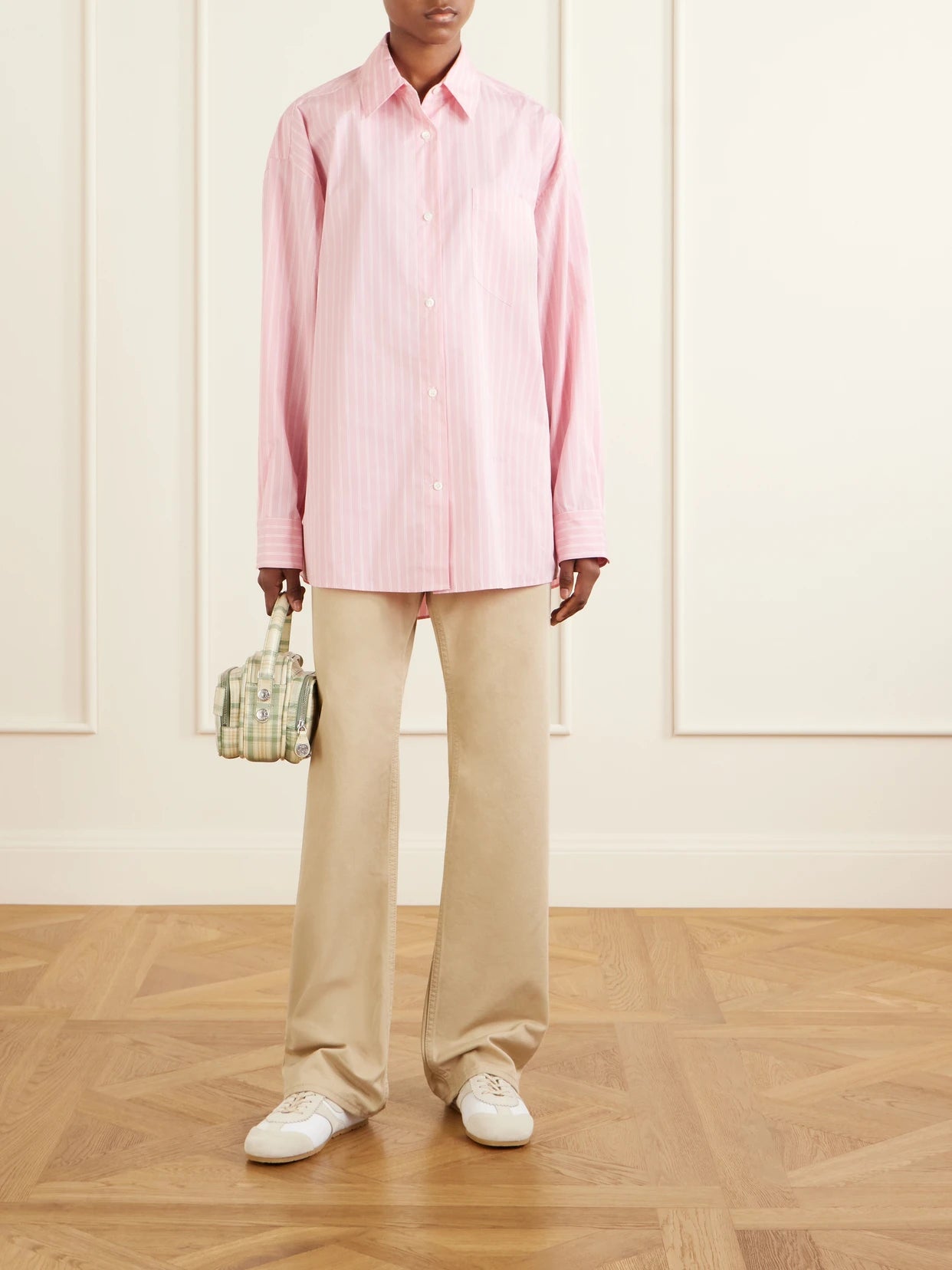 Image of a model wearing Tops. Product name - Striped Cotton-blend Shirt in Pastel pink colour by brand - Marni