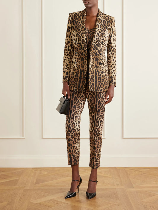 Image of a model wearing Pants. Product name - Leopard-print High-rise Cotton Straight-leg Pants in Leopard print colour by brand - Dolce & Gabbana