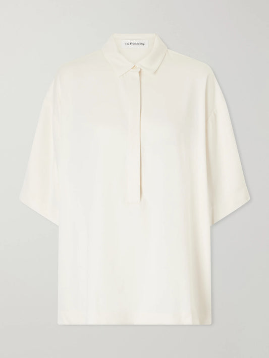 Image of a model wearing Tops. Product name - Eda Cady Polo Shirt in Ivory colour by brand - The Frankie Shop