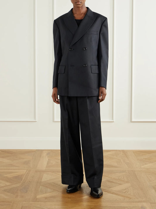 Image of a model wearing Outerwear. Product name - Pinstriped Wool-blend Double-breasted Blazer in Black colour by brand - Junya Watanabe
