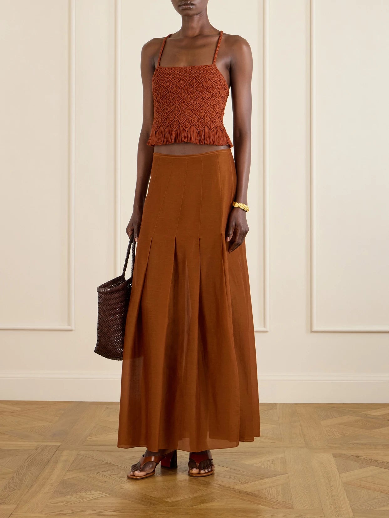 Image of a model wearing Skirts. Product name - Lauri Cotton Maxi Skirt in Brown colour by brand - ESCVDO