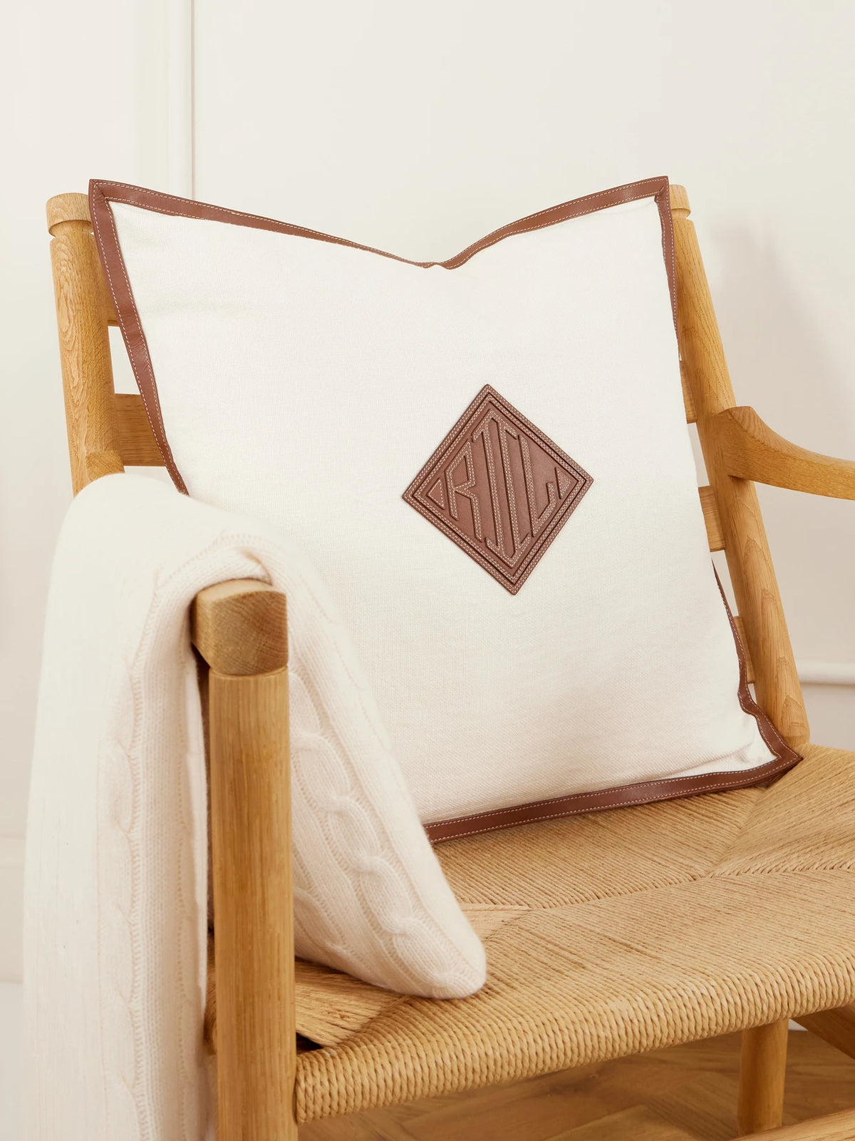 Image of Chair & Sofa Cushions. Product name - Moore Leather-trimmed Linen Cushion in Cream colour by brand - Ralph Lauren Home