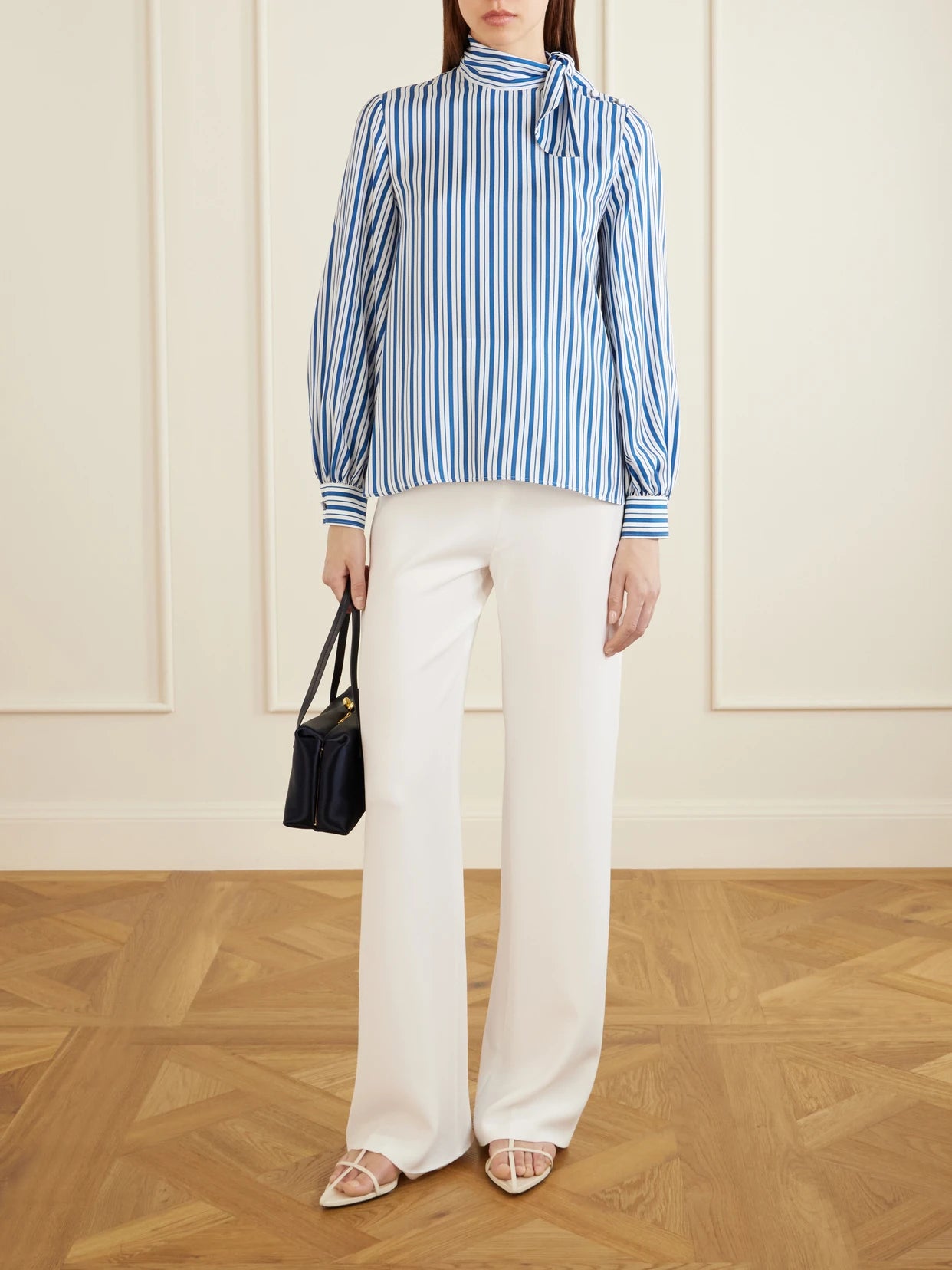 Image of a model wearing Tops. Product name - Striped Silk Shirt in Blue colour by brand - Max Mara