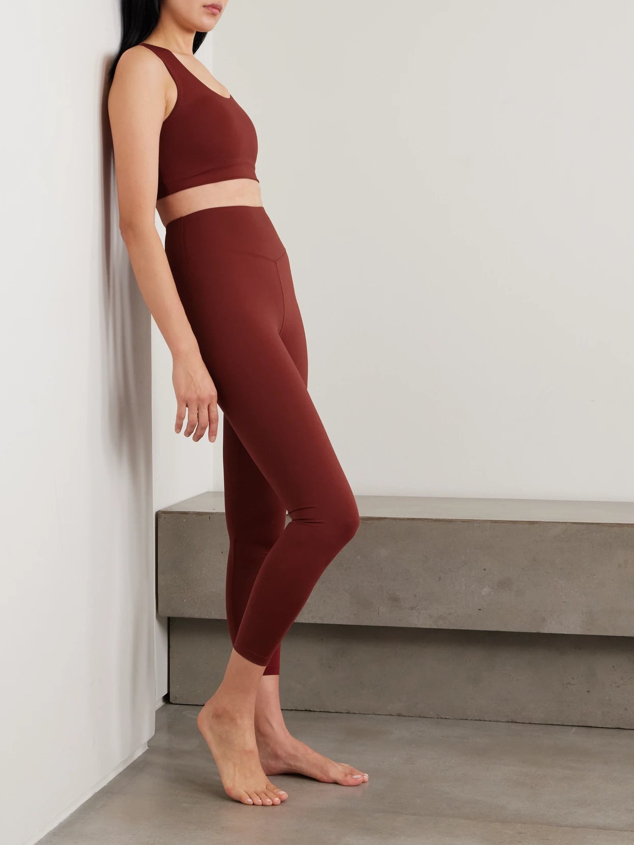 Image of a model wearing Pants. Product name - Bille Embroidered Stretch-jersey Leggings in Burgundy colour by brand - Eres