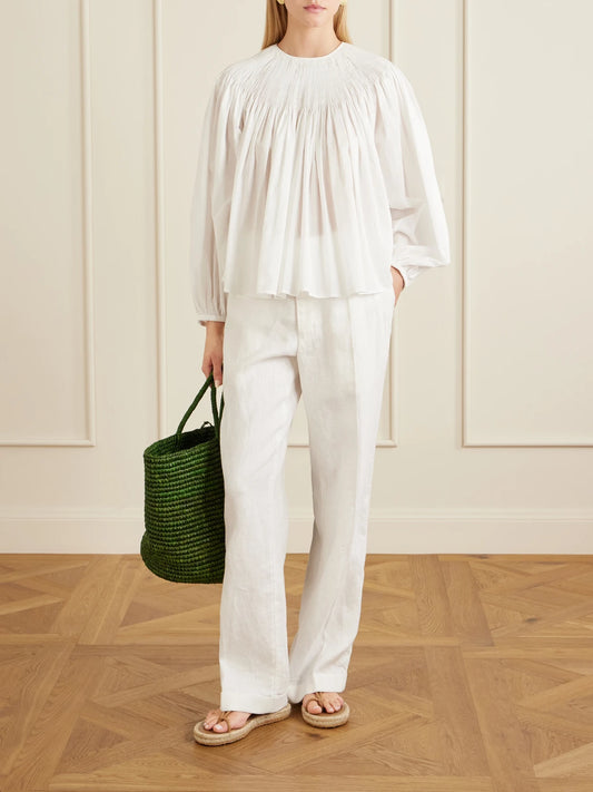Image of a model wearing Pants. Product name - Pleated Linen Straight-leg Pants in White colour by brand - Polo Ralph Lauren