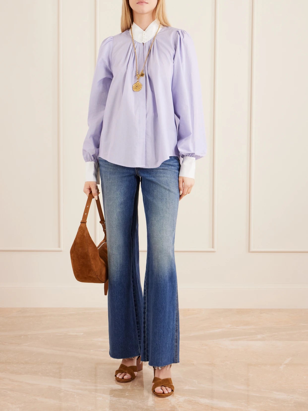 Image of a model wearing Tops. Product name - Val D'isere Striped Cotton Blouse in Blue colour by brand - MAISON MAYLE