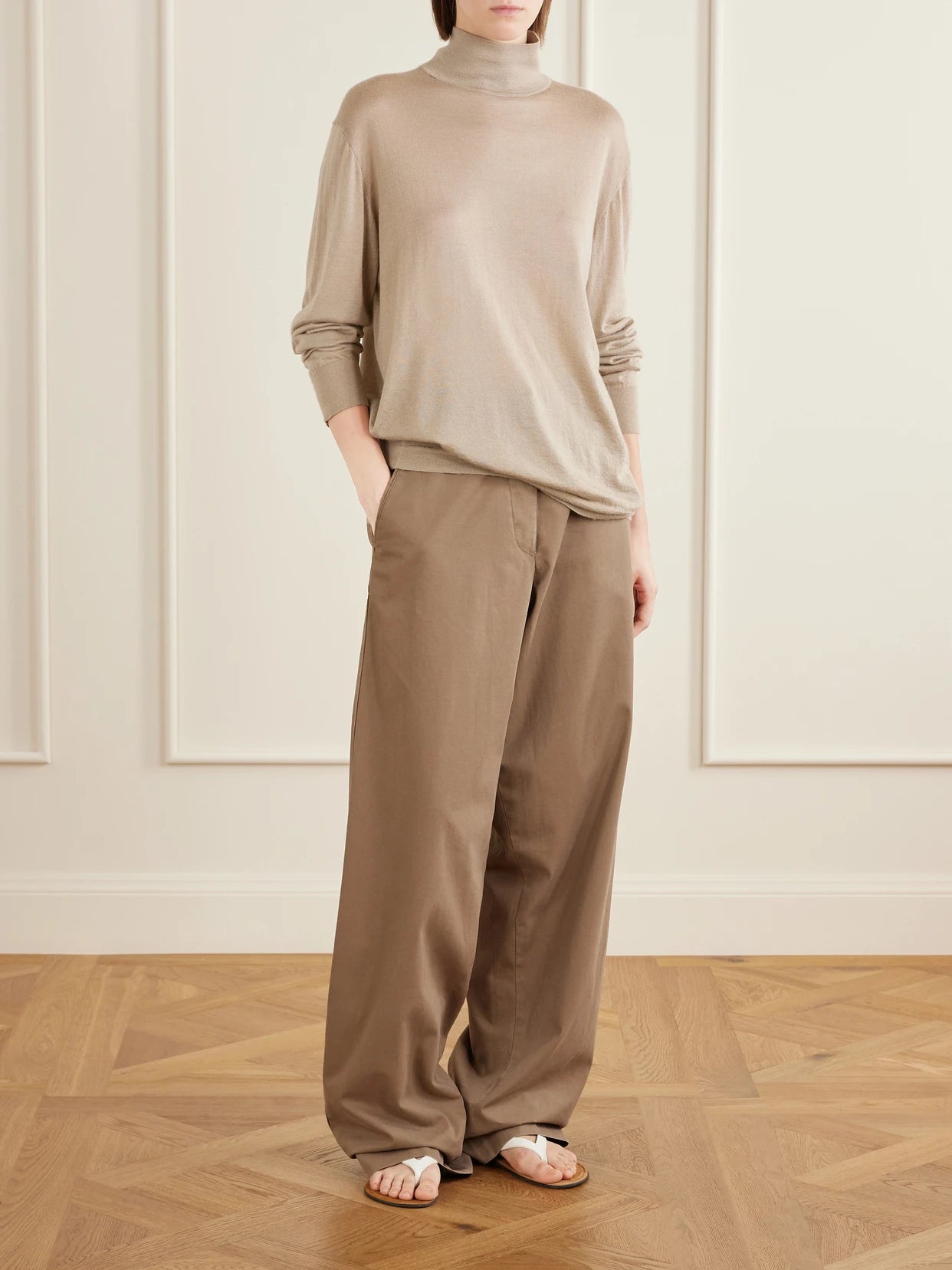Image of a model wearing Pants. Product name - Fadry Cotton And Cashmere-blend Drill Wide-leg Pants in Sand colour by brand - The Row