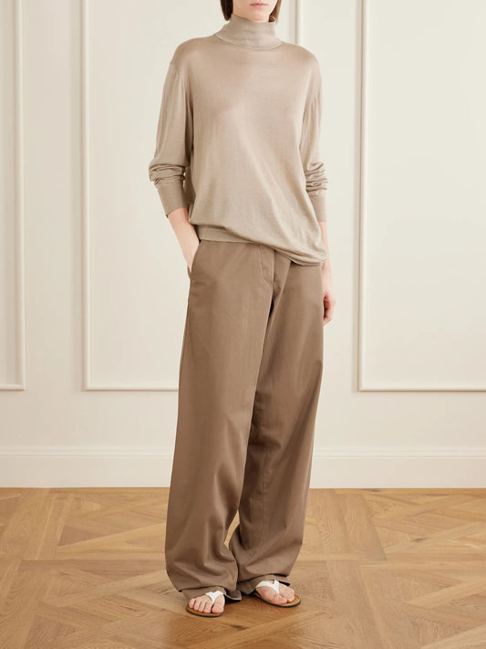 Image of a model wearing Pants. Product name - Fadry Cotton And Cashmere-blend Drill Wide-leg Pants in Sand colour by brand - The Row