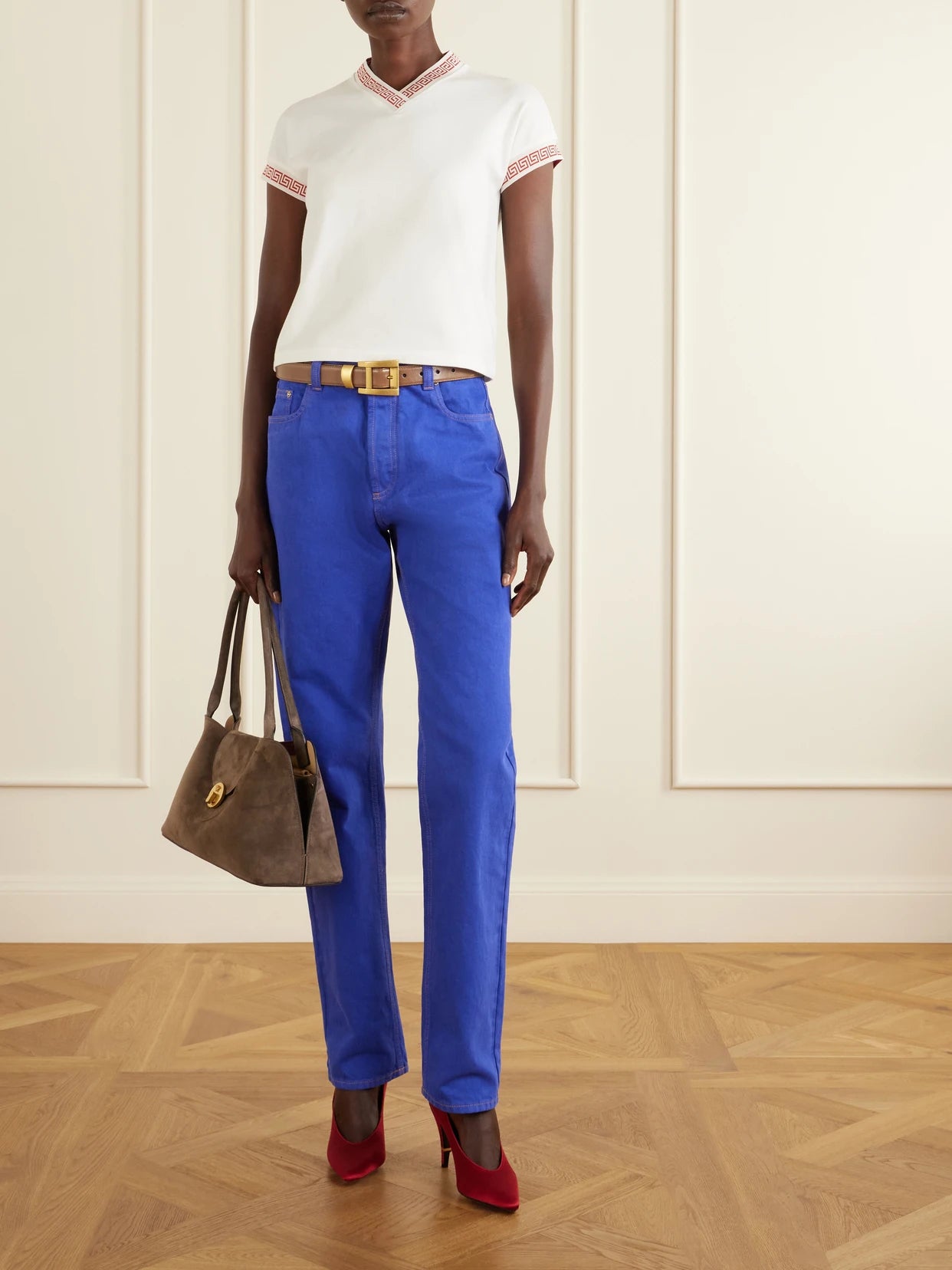 Image of a model wearing Tops. Product name - Logo-jacquard Cotton-blend Jersey T-shirt in White colour by brand - Versace