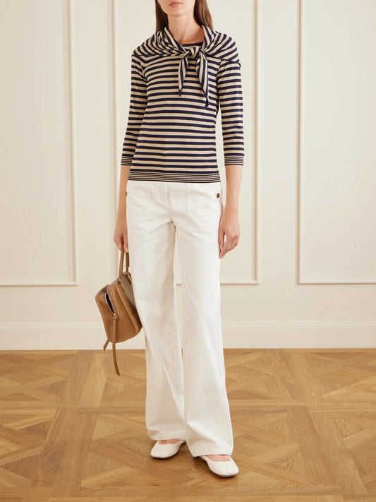 Image of a model wearing Outerwear. Product name - Tie-detailed Striped Jersey Sweater in Black colour by brand - Max Mara