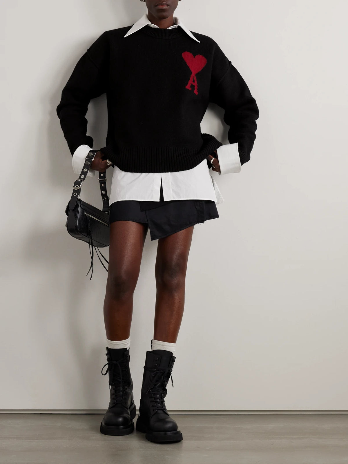 Image of a model wearing Outerwear. Product name - + Net Sustain Adc Intarsia Wool Sweater in Black colour by brand - AMI PARIS