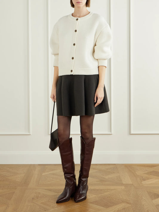 Image of a model wearing Outerwear. Product name - Emmylou Cashmere Cardigan in Cream colour by brand - LISA YANG