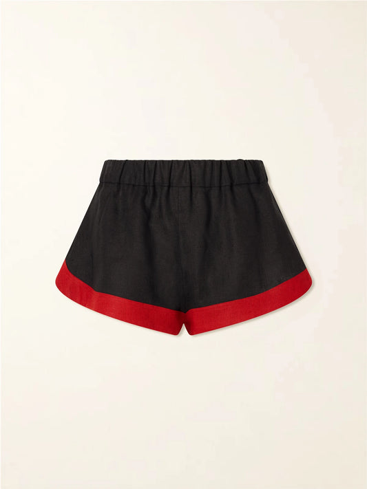 Image of a model wearing Shorts. Product name - Stella Tiered Linen Shorts in Black colour by brand - LIBEROWE